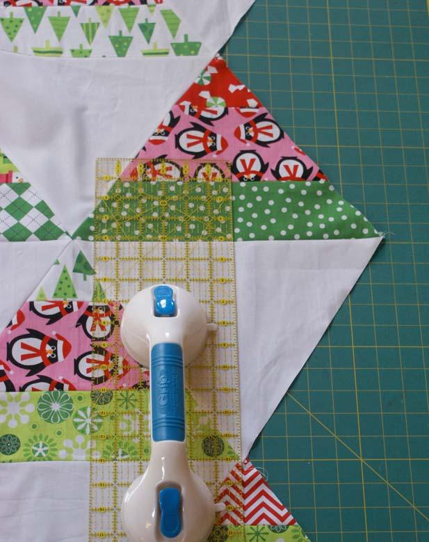 Once you have put the top together, you will have jagged triangle edges on the right and left sides of the quilt.
