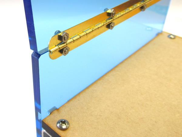 Attach the pressure plate to the hinge on the rear panel using four #3 (M2.5) screws and nuts.