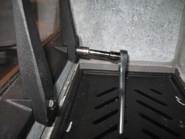 3. Use a 1/2 socket or wrench to remove the andirons and