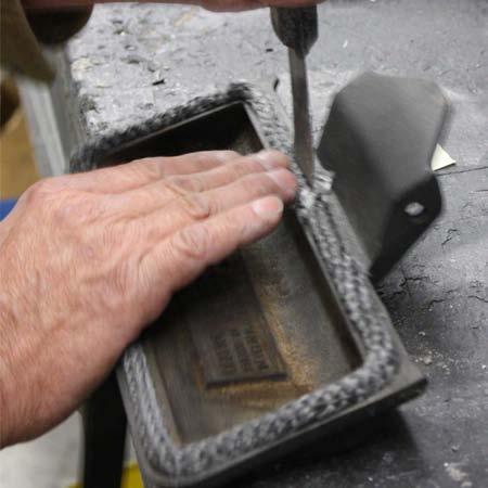 6. Install ash door onto stove base. Keep the door closed to seat the gasket. Sealing the firebox seams 1.