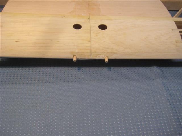 Enlarge the two 1/8 diameter holes in the leading edge to 1/4 diameter. The 1/4 diameter hole should be a slip fit for the wood dowels.