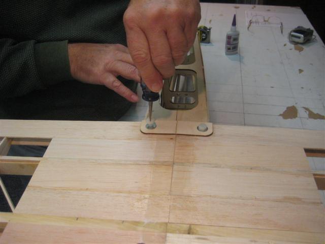 When the glue is dry, tap the holes with a 1/4-20 tap.