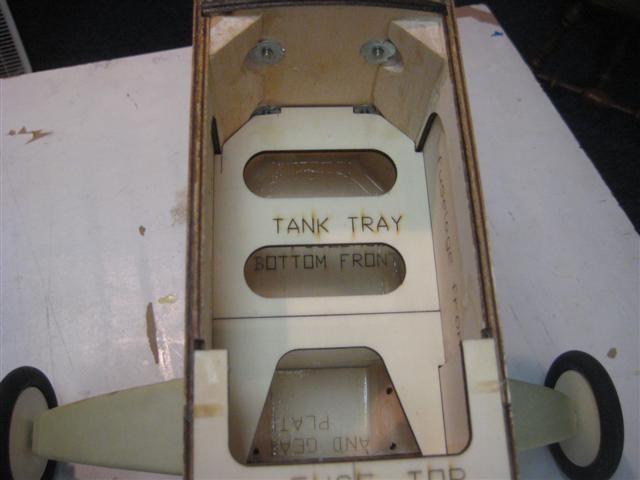 Remove the wing and install the tank tray.