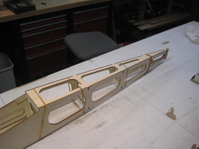 Once the total assembly is held in place with the rubber bands, slide the laser cut lite ply Fuselage