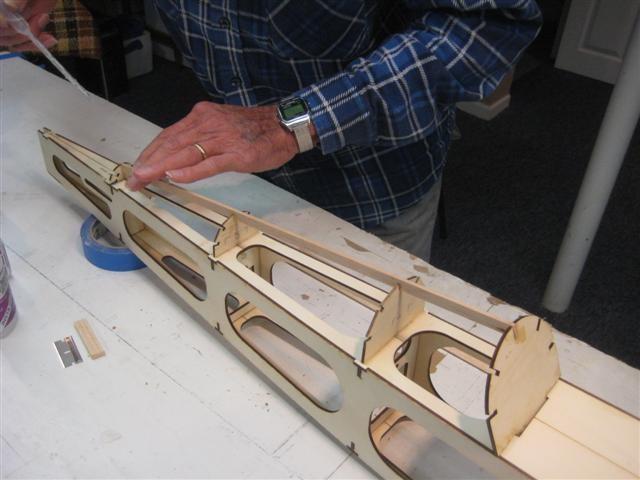 After the glue dries, trim off the ends of the stringers flush to the