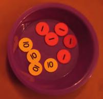 For the next turn, player 2 selects the correct number of place value counters. Each time, the other player checks their answers. Make 10.