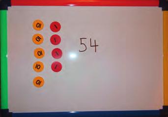 Ask children to take turns taking nine counters from the bowl. They must arrange them in the correct place value columns and then say that number.