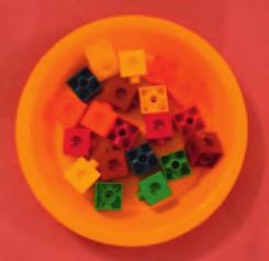 Show me 7 cubes. Count reliably to 20. Present each child with a bowl containing 20 cubes.