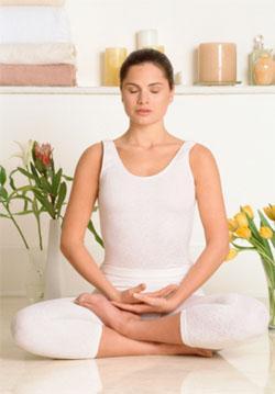 Half-Lotus position (above): Sit upright with your spine straight and cross one leg on top of the other while the other leg is resting on the floor or cushion beneath you.