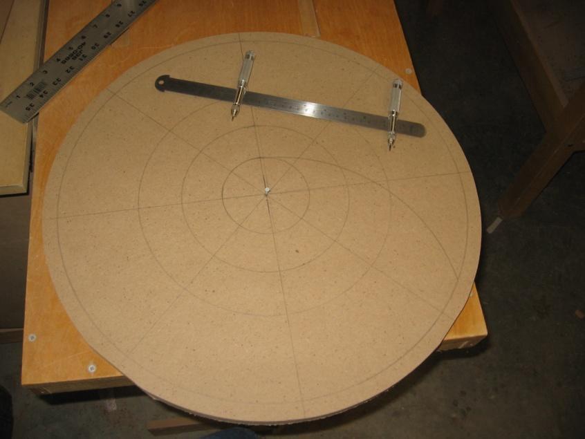 Draw a circle around the intersection of circle #3 and each of the eight radial section lines. This is where your compass point (and ultimately your router trammel point) will be placed.