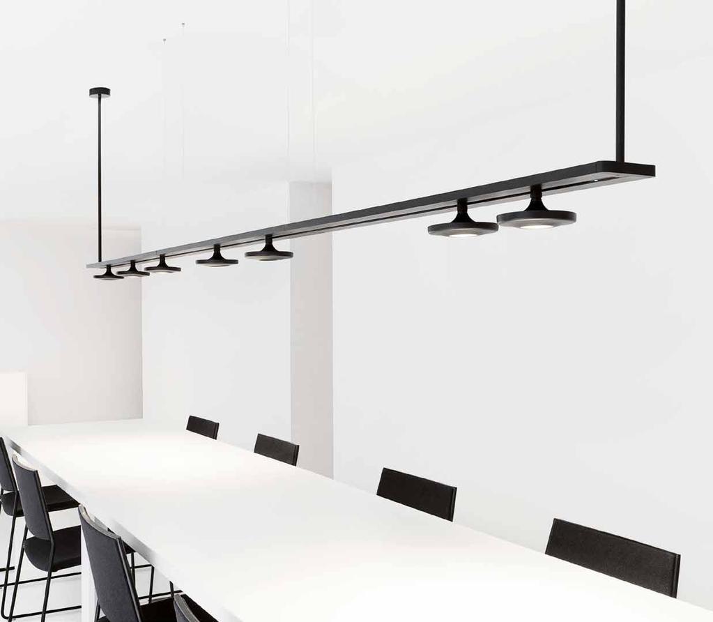 BUTTON by Francesc Rifé Linear pendant with metal heads connected to a track enclosed in a decorative shelf.