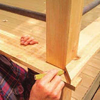 you don t want to goof up on these expensive posts. Notch the decking for the posts (Photo 12). Then drive 3/8-in. x 4-in. lag screws through predrilled 3/8-in. clearance holes to secure the posts.
