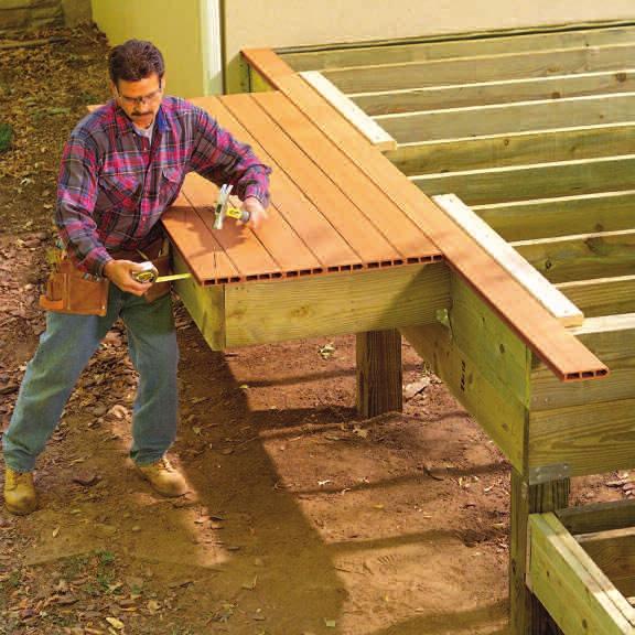 FULL-LENGTH DECK BOARD DECKING NOT NAILED NAIL 1-1/2" OVERHANG TEMPORARY BLOCK 1-1/2" OVERHANG NAIL THROUGH TONGUE 9Set a fulllength deck board to overhang the joists by 1-1/2 in.