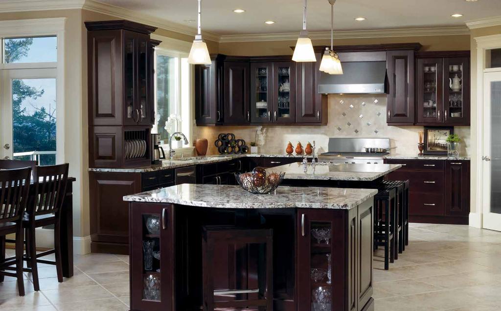gracious Two large islands establish the scale, detail and sculptural quality of this kitchen and anchor its open flow.