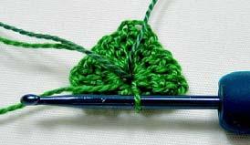 Cut a long tail end (so you can thread a needle later) and tie on your darker green. Turn the leaf back so the front is facing you.