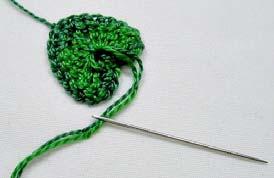 Pull a loop up and slip stitch it. Catch the bottom, point, stitch of the leaf.