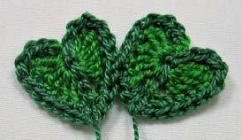 Pick up the first leaf and Single Crochet (sc) the next stitch into both of them.