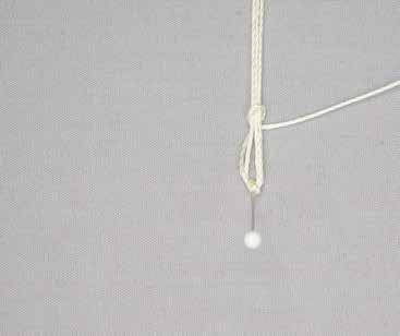 a c e f b d Attach the Clasp Hold the cords that measure 130" (76cm) and 50" (1.27m) as one, and make an overhand knot 15" (38cm) from one end. Pin the knot to the board.