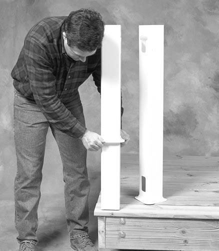 Hand tighten the brackets on the post support. Slide the vinyl post over the brackets.