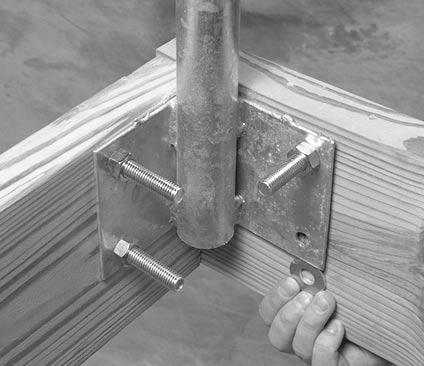 JOISTS. If you mount them at the bottom, the pipe may not extend far enough to attach the rail lock plate later in the installation.
