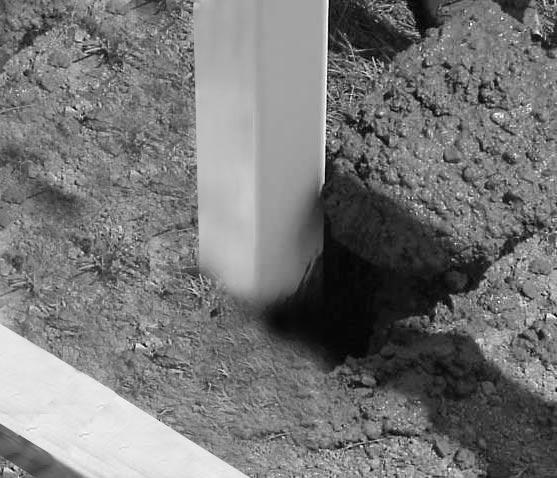 Check the height and fill the hole with concrete until it is approximately 2" from the top of the hole.
