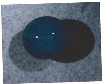 However, on closer inspection, the triangular "faces" visible in the larger "bubbles" (figure 14) indicated that the inclusions were negative crystals