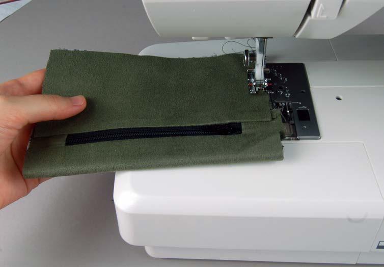 11 When your zipper section 12 is all nicely pressed, fold the entire pocket in half widthwise with the lining pieces