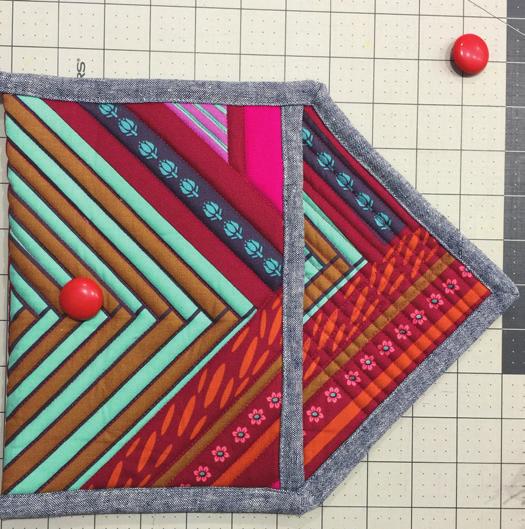 If making the clutch for any other size, measure from the center of the button you just sewed on, 2 to the left and mark it. Sew the last button on at this point.