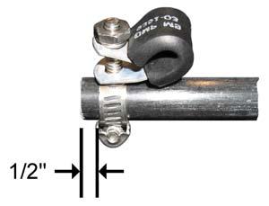 Tighten each spreader rope connection assembly 1/2 " from the end of each spreader and tighten with the clamp stud and cushioned p-clamp are positioned vertically as shown in Figure 17.