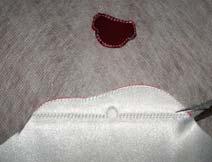 15) Trim the excess fabric from the outside of the stitched lines. See Photo 07 16) Continue stitching the design.