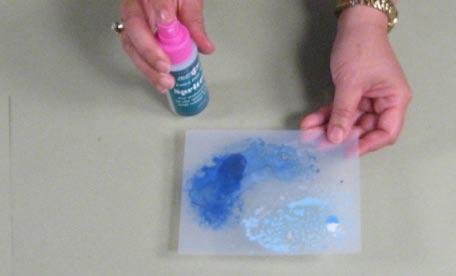 2 Pick up some of the paint with a Color Duster from JudiKins and spread it onto the Micro Glazed image from Step 1.