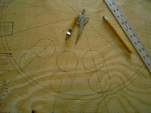 What you will do is use your hole saw to cut the two small circles. Then use your hand jig saw and cut down the two lines that connect the circle. This leaves you with a 2 ½ x 5 slot.