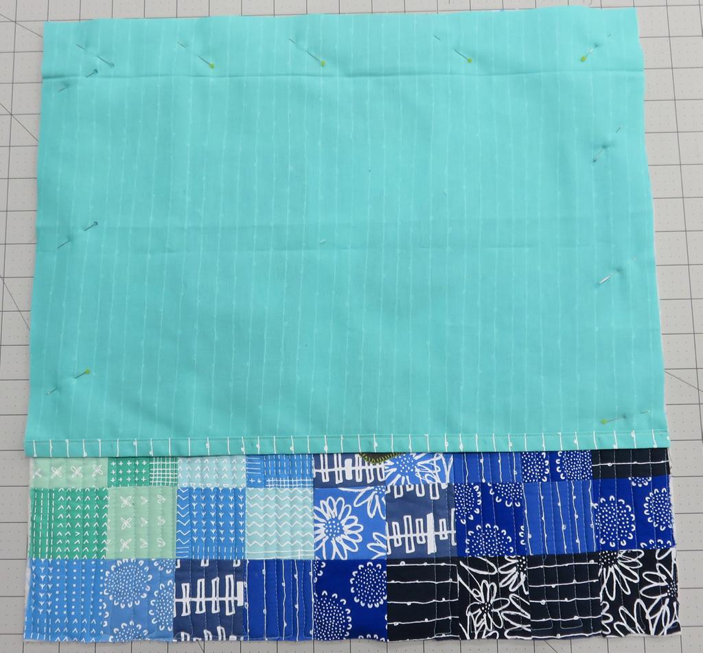 Place the quilted pillow top right side up on a flat surface.