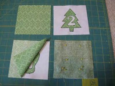 STEP 2 - MAKING FLAPS or POCKETS With your appliqué all done, you are ready to move on to making the flaps or pockets for your calendar Start by finding the red
