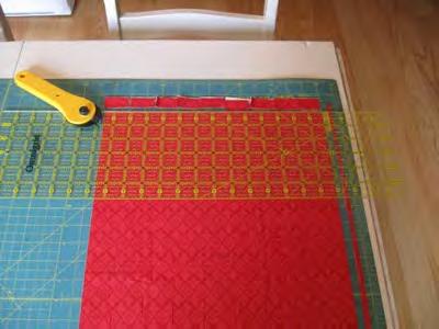 line on your mat. Align your ruler up along the marks on vertial marks on the top and bottom of your mat and cut a nice straight edge to start with.