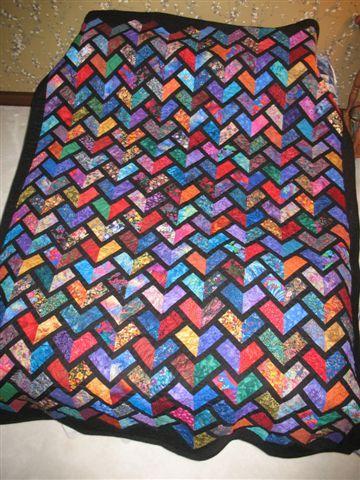 Minimum bid $40 Item 8 Wendy Kinzler quilt in Stained Glass pattern This handsome quilt was made by Wendy Kinzler in the "Stained Glass" pattern she used in one