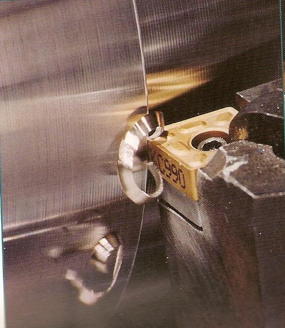 Turning Operation Close-up view of a turning operation on steel using a titanium nitride coated
