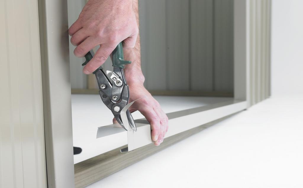 Attach Door Jamb Flashing with three 30mm clouts into studs on the inside and three 50 mm nails on the outside. Pre-drill holes on the outside to protect flashing.