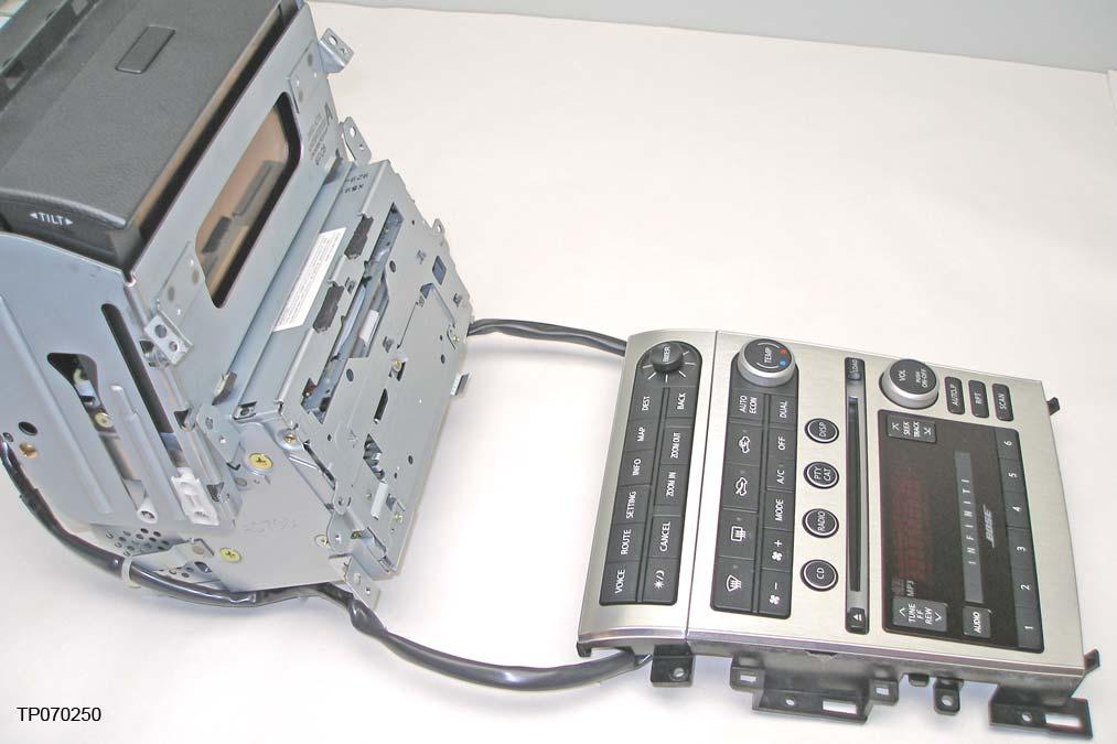 9. Place the faceplate down and away from the audio frame as shown in