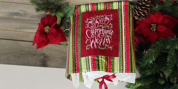 Festive Fabric Gift Bag Add a personal touch (and fa-la-la festive embroidery) to your holiday gift wrap this year with a homemade fabric gift bag.