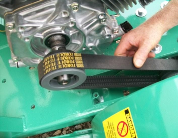 To complete Belt tightening procedure, tighten all 4 Bolts at base of Engine and replace Upper Belt Cover.