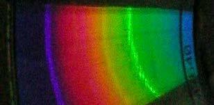 Fluorescent light The photograph above was made using the homemade spectroscope we will make in this project. You can see a bright green line, a bright blue-purple line, and a fainter orange line.