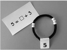 Number Bracelet Partner activity one partner hides some beads and the other partner has to figure out how many are hidden. Number bracelets are great for the hiding assessment.