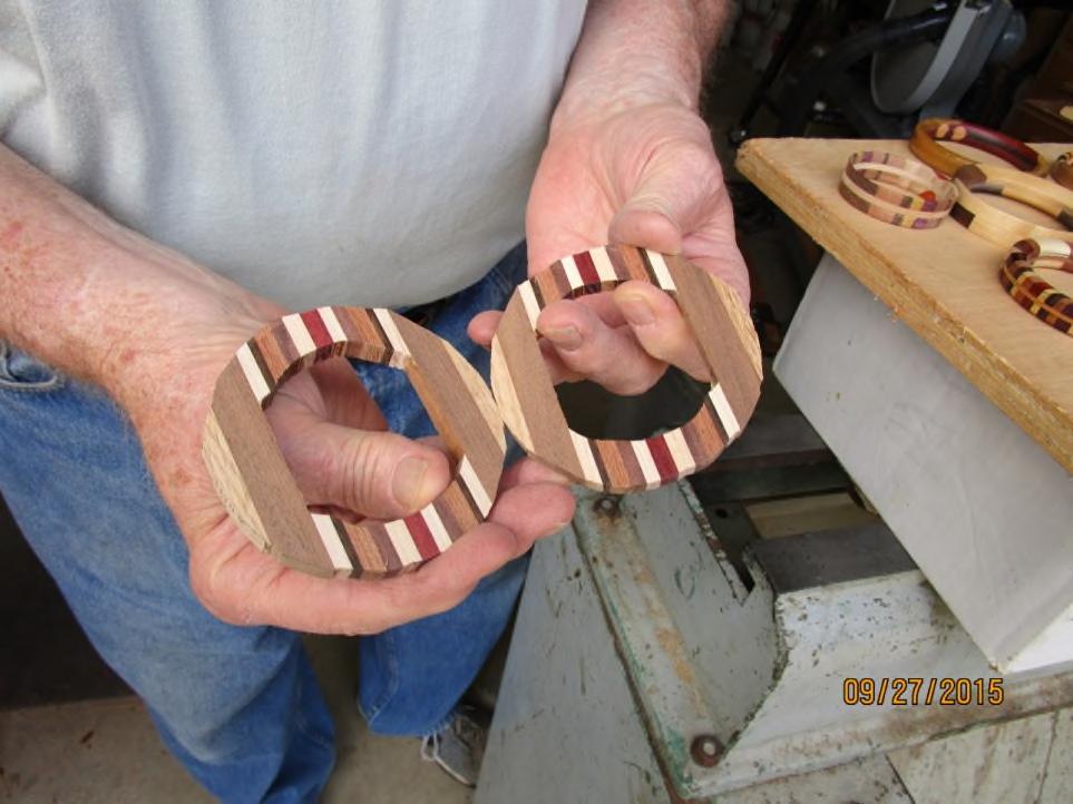 7. With a jig as shown above insert the bracelet blank and re-saw against band saw fence, producing two halves. The jig should be hardwood and at least half the thickness of the bracelet blank.