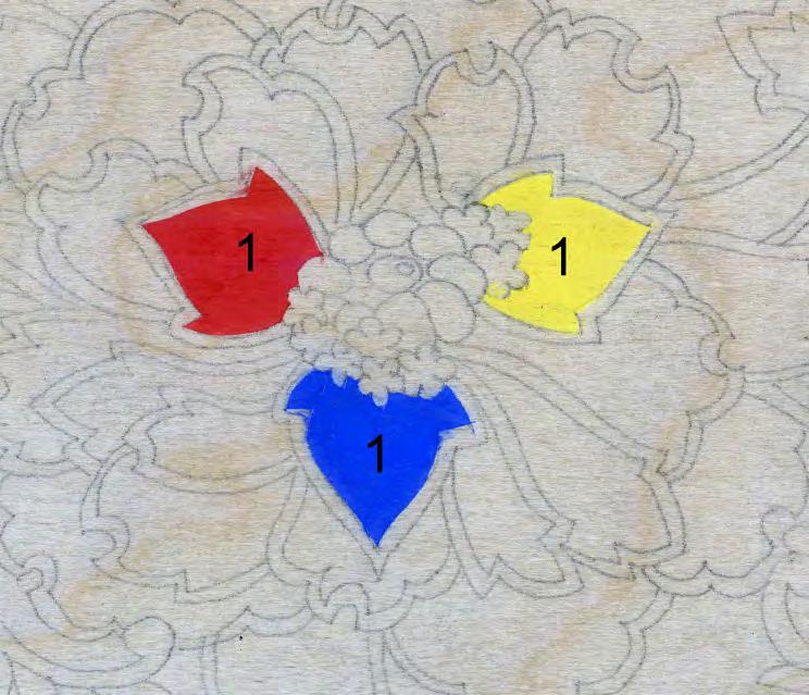 STEP 6 Place a small amount of your pure red, yellow, and blue on a palette. With a small shader fill in each area by laying the color with the direction of the wood grain.