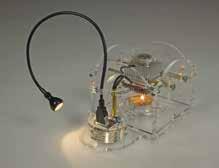 The enclosure also acts as a wind screen for the candle flame. Mount the thermoelectric generator in the enclosure, and mount the converter board.
