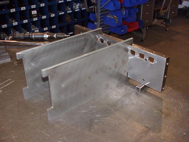Lift one of the end plates, and position the first partition plate.