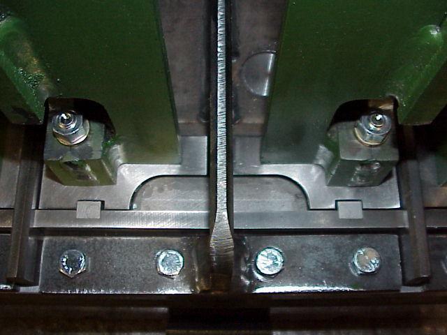 Set the mold box in the mold alignment fixture or Block Machine. Place each head plunger/shoe assembly into their respective cavities, centering them.