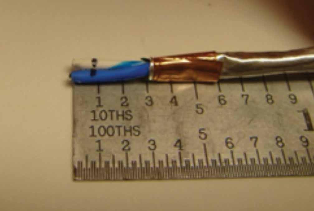 12. Using cutters, remove the polyimide tape and the foil until you reach the copper tape placed in step 11 (Figure 20).