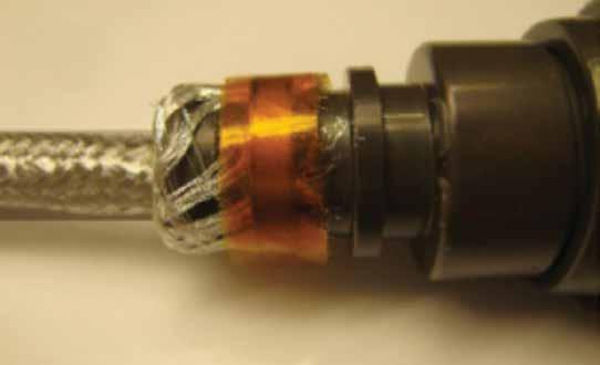 27. Slide the connector grommet to the plug, and torque it to 40 inch-pounds using the appropriate torque fixtures (Figure 37). 31.